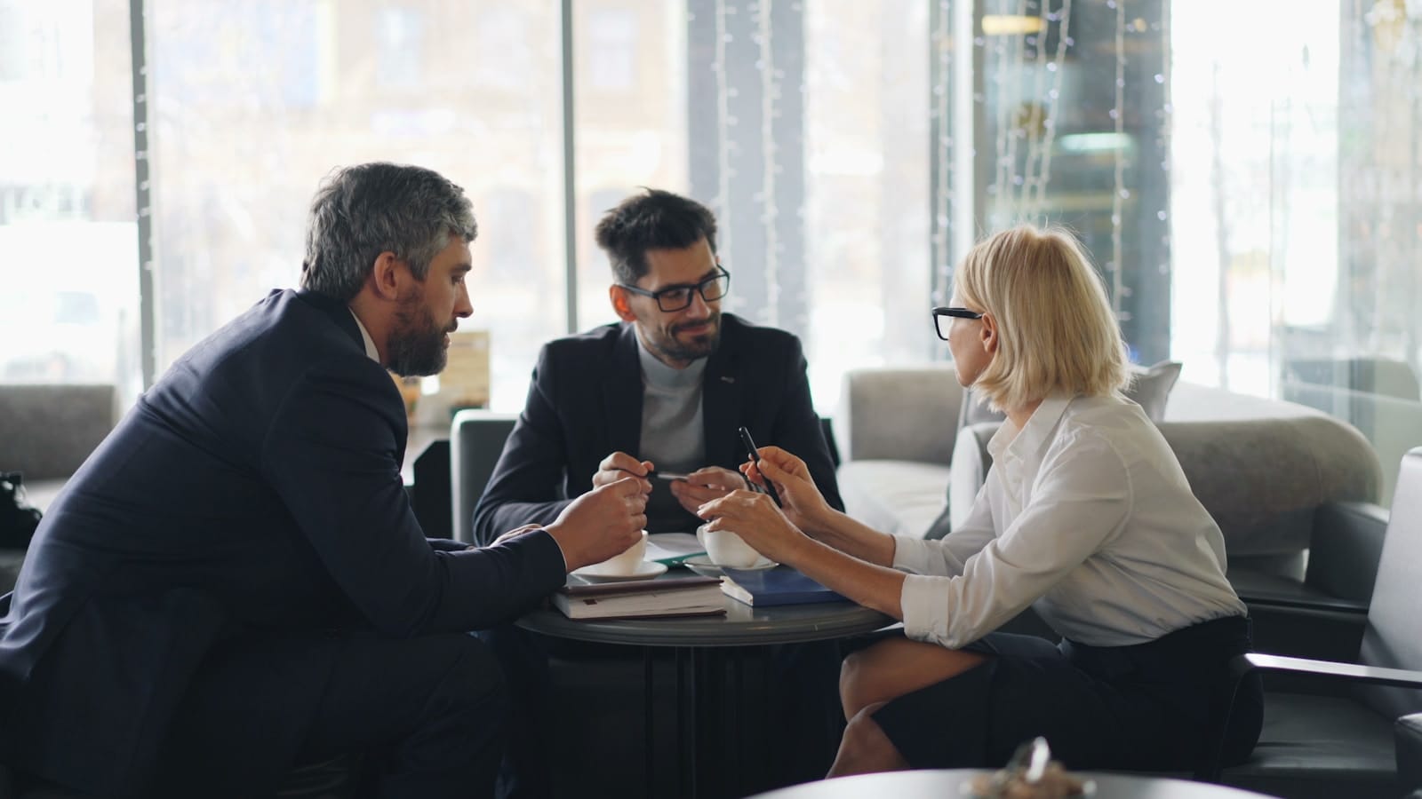 A Group of People Sitting Around a Table.